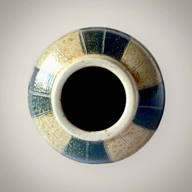 A fantastic urn or vase if desired from Bay Pottery. Soft shapes and calm colors in beige and black can lift the decor in...