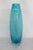 This magnificent Vase has classic Mid Century style with an impressive tall silhouette and a lovely blue color. We believe...