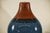 This pair of contemporary artisan-crafted ceramic vases offers a striking combination of bold color and meticulous...