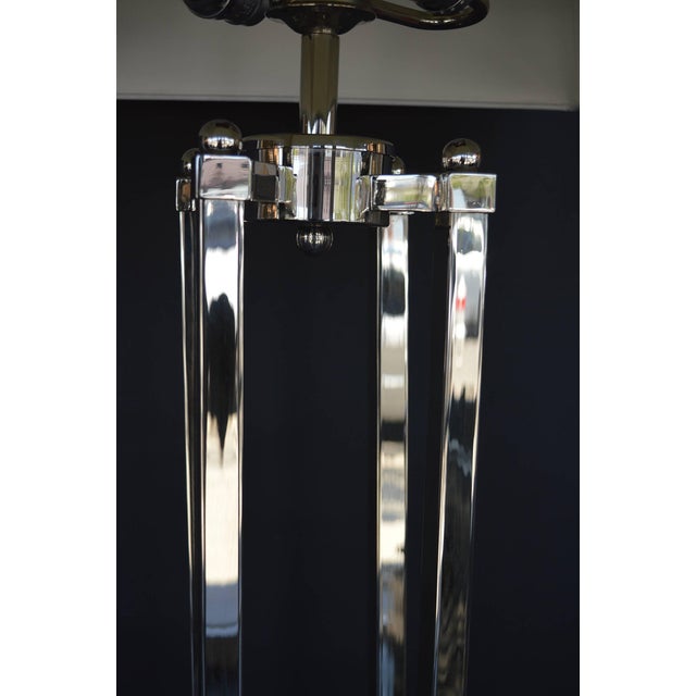 Pair of American deco floor lamps. Metal, nickel-plated.
