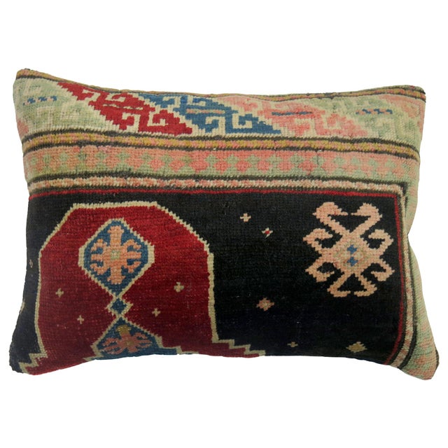 Pillow made from a vintage Turkish rug derived from an antique Khotan rug with zipper closure included. Love the color...