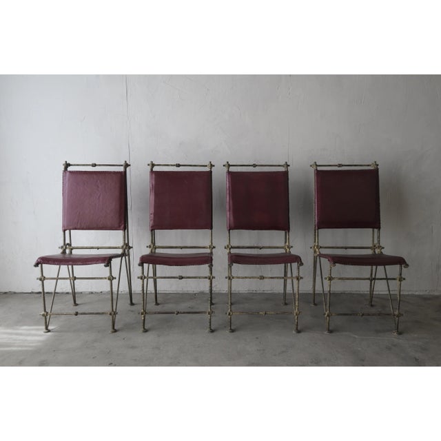 Substantial set of 4 iron and leather dining chairs by Ilana Goor. This set is heavy duty and truly unique. Israeli artist...