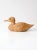 This vintage wooden duck features rustic hand-carved details, a natural unpainted finish, and glass eyes that add a subtle...