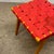 c. 1960s. Wood frame with red webbing. This piece is attributed to the mentioned designer/maker. It has no attribution...