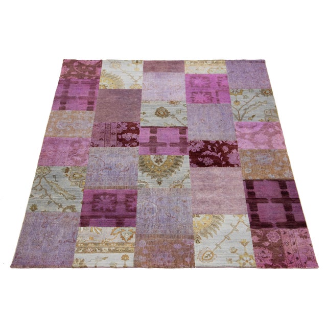 Introducing a stunning handmade modern wool rug that features a captivating pink field. This piece is adorned with a...