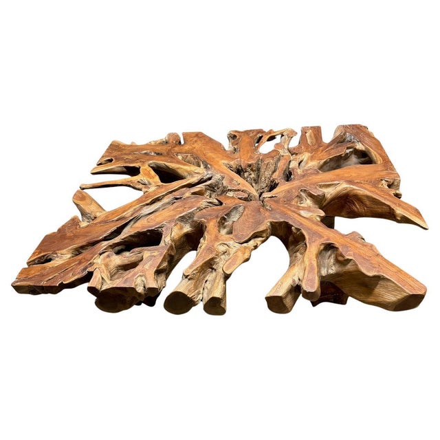 A century old impressive teak root slab with beautiful patina that tells a story of its rich history. We added teak block...