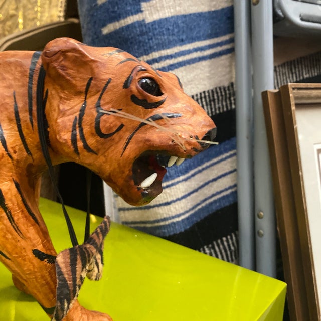 This is a beautiful small tiger sculpture with a bow around its neck! Perfect for the interior designer or the enthusiast!