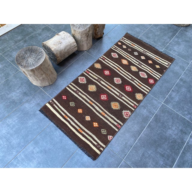 This is a vintage Turkish Oushak rug from the 1960s. The piece was hand-knotted.