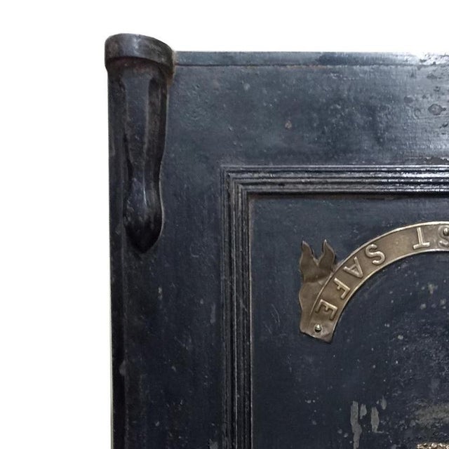 Furniture - Safe - 19th Century. English, 19th/20th century; made of iron with embossed yellow metal applications bearing...