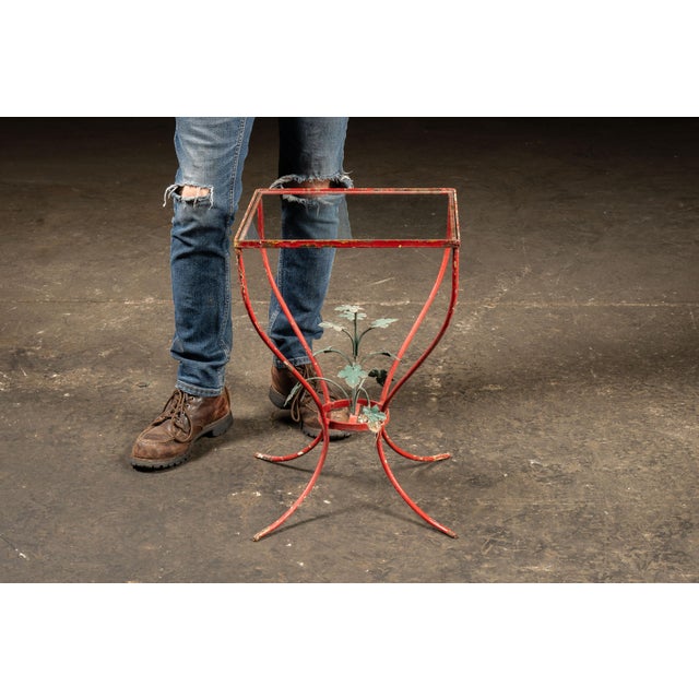 Vintage wrought iron plant stand or display pedestal. This charming stand features a curvilinear wrought iron frame with a...