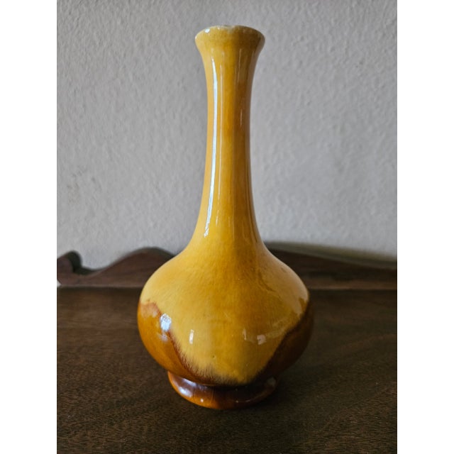 Bright and fun, Haeger bud vase. Lovely yellow/gold and brown glaze. Sleek and modern design. Some imperfections in the...