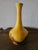 Bright and fun, Haeger bud vase. Lovely yellow/gold and brown glaze. Sleek and modern design. Some imperfections in the...