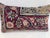 Decorative pillow upholstered in a 19th century Kerman rug fragment, featuring charming floral flowerhead motifs and an...