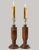 Pair of English oak candlesticks, early 20th century, featuring richly grained tiger oak in a bold, chunky architectural...