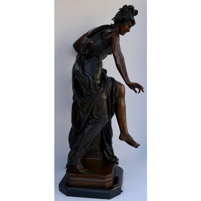 This is a late 18th century Le Melodie bronze sculpture by Albert-Ernest Carrier-Belleuse. It features a lady with her...