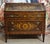 A louis xvi style drop-front secretary desk, crafted from richly inlaid precious woods, featuring a refined decoration of...