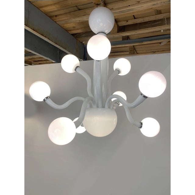 Lively Murano glass chandelier in glossy white color. Contemporary piece of italian art of blowing glass. Very elegant for...