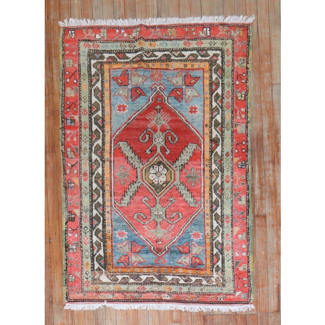 Quirky Antique Turkish Anatolian floral rug featuring vibrant colors. Measures: 3'3'' x 4'10".