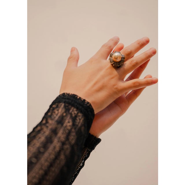 The Gorgeous Prairie Rose Ring features a South Sea golden pearl with a beautiful luster. This stunning piece is adorned...