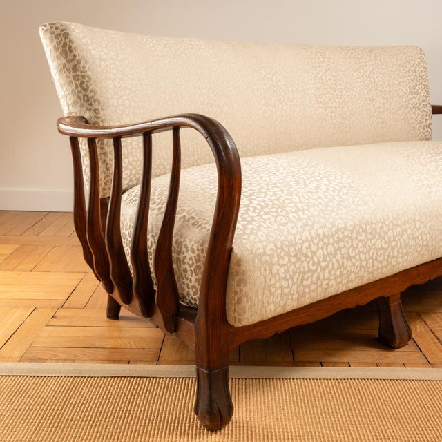 Ernesto Valabrega Sofa - Italy, 1940 Dark wood frame with organic shapes and zoomorphic legs. 3-seater sofa reupholstered...