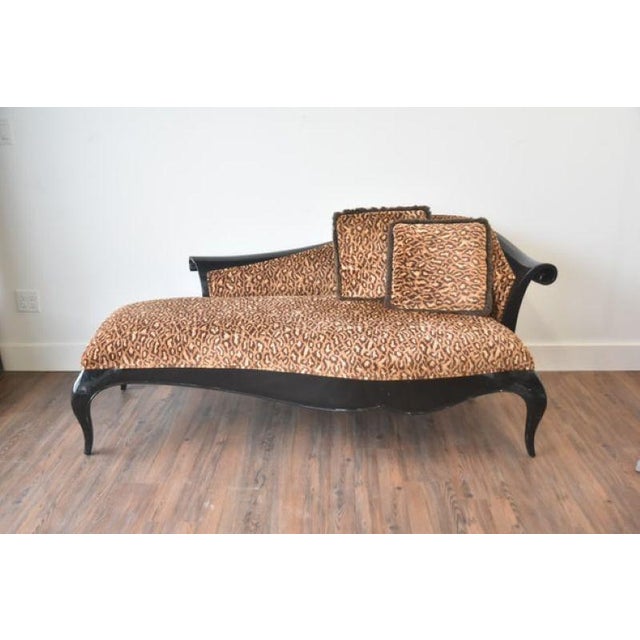 Christoper Guy Designer black ebonzied mahogany frame chaise lounge with criss cross patented legs with leopard print...