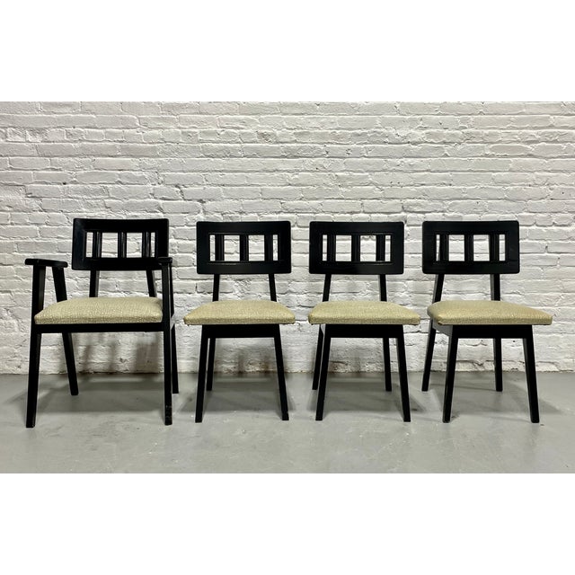 Set of Four Mid Century Modern Ebonized Dining Chairs, c. 1950's. The square spindled back supports are funky yet...