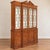 This is an English Smith & Watson Chippendale style Burl yew wood bookcase cabinet. The top interior does have two lights...