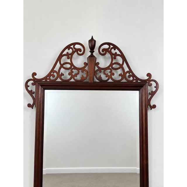 Baker Georgian Chippendale Carved Mahogany Wall Mantel Mirror Fretwork Crest A stately Baker mahogany mirror rendered in...