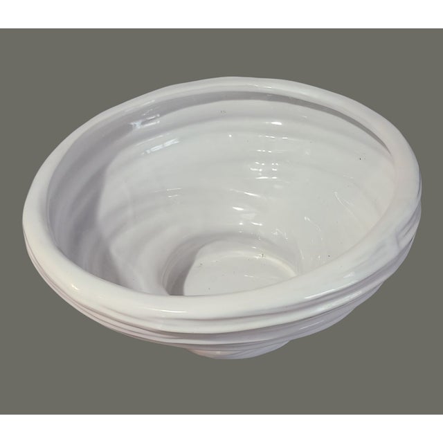 Experience the timeless elegance of mid-century design with this Vintage White Ceramic Vortex Bowl. The bowl's ribbed...