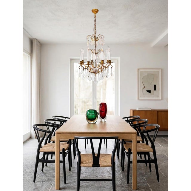 It uses eight E14 bulbs (not included). The chain shown in the photos hangs 105 cm in total. It's very easy to shorten by...