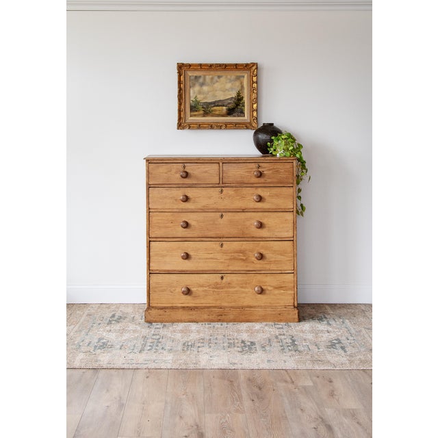 Crafted from solid pine, with a classic graduated drawer configuration with hand-turned wooden knobs and small escutcheon...