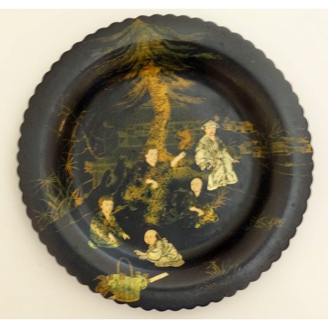 Fine quality pair of early English lacquered papier mache gaming plates hand painted with figures in gilt and soft colors....