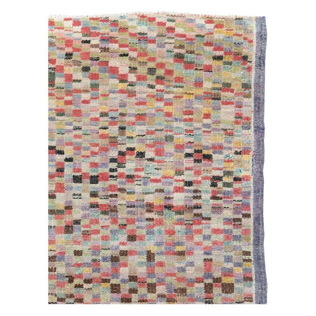 A vintage Turkish Anatolian accent rug handmade during the mid-20th century with a colorful asymmetrical checkered design....