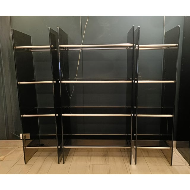 Modern Italian modular, self-supporting bookcase with chrome-plated metal frame and smoked tempered glass dating back to...