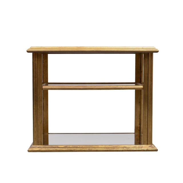 Unique stunning serving table wrapt in a thin layer of oxidized Brass . so stylish ,on wheels ,Mirror tops . Very good...