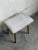 Vintage Danish Mid Century Modern vanity stool featuring solid teak tapered legs and a softly curved upholstered seat....