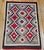 A dynamic and visually captivating example of traditional Navajo textile art, this early 20th-century Eye Dazzler rug is...
