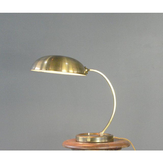 Gecos Table Lamp Circa 1950s Curved adjustable brass arm and shade - Takes E27 fitting bulbs - On/Off switch on the base -...