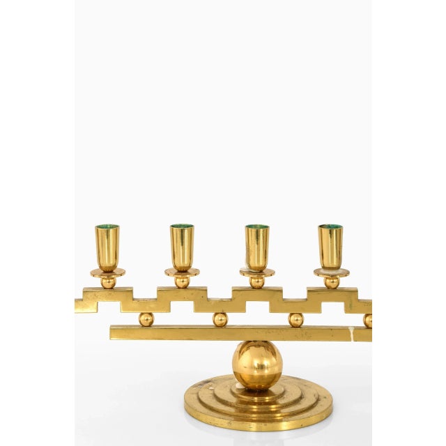 Rare candlestick designed by Lars Holmström. Produced in his own workshop in Arvika, Sweden. Wear consistent with age and...