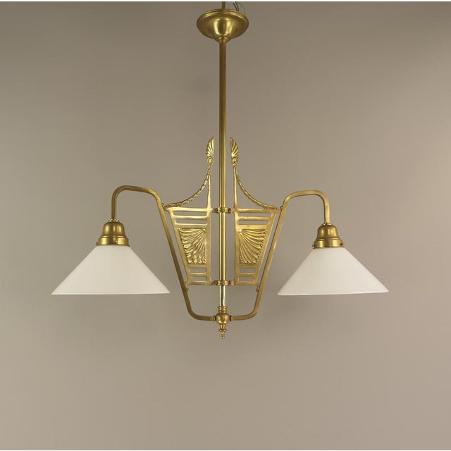 This two-armed hanging lamp for the dining or gaming table is a beautiful example of the Art Nouveau era. Polished...
