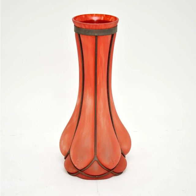 An absolutely gorgeous vintage glass and pewter vase. It’s tricky to date, but I would say this is from around the...