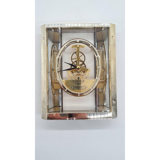 An original Seiko Quartz table clock in an impressive skeleton version (visible mechanism). The clock has a transparent...