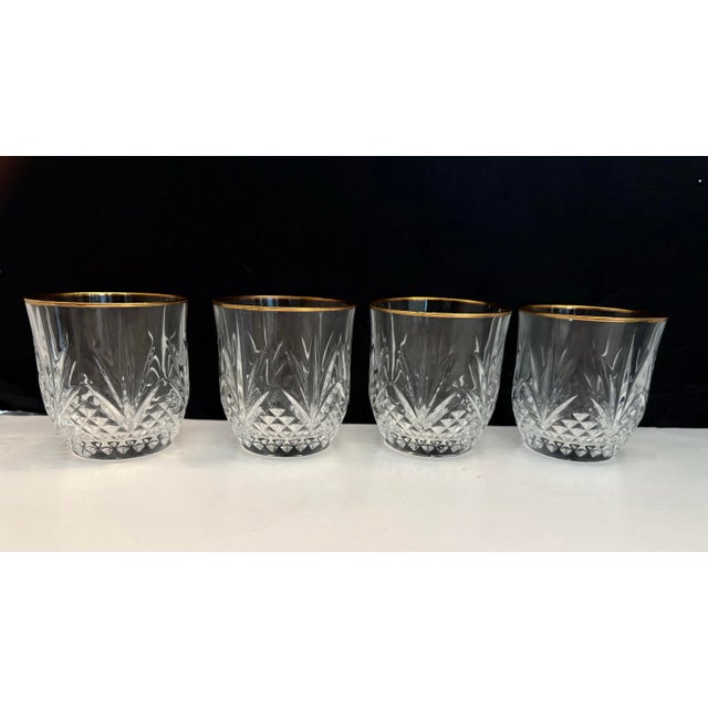 A refined set of four vintage tumblers featuring an elegant pineapple cut motif and hand-applied gold rims. The...