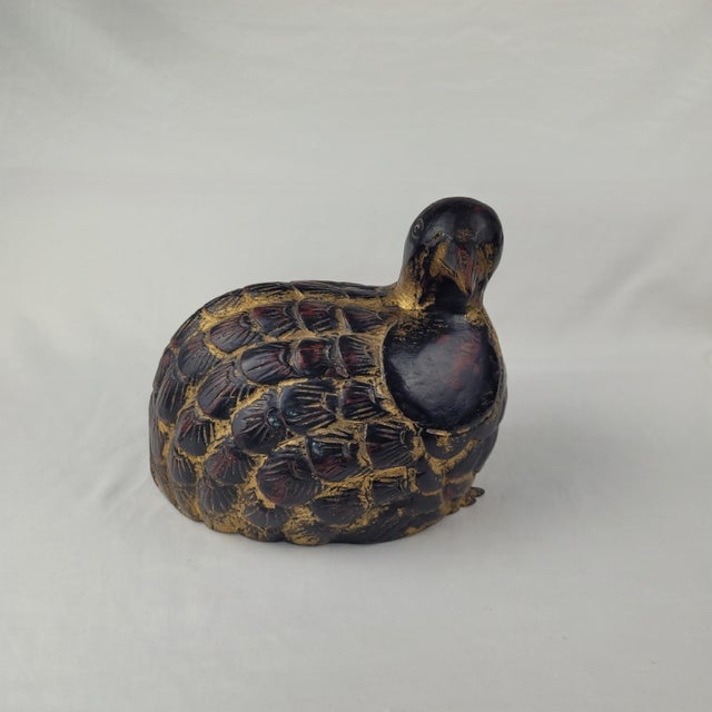 Hand-carved wooden quail statue featuring a rich black lacquered finish with elegant gold-tone accents. This antique-style...