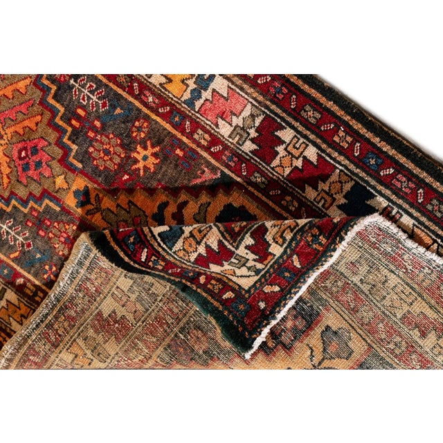 Beautiful Vintage Persian Malayer Handmade Wool Rug with a brown field. This Malayer runner has a multicolor accent in an...