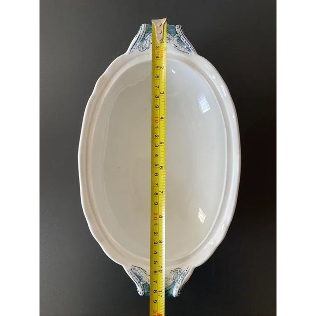 A beautiful English white and blue floral oval porcelain serving bowl, circa early 20th century, Europe. Great as a...