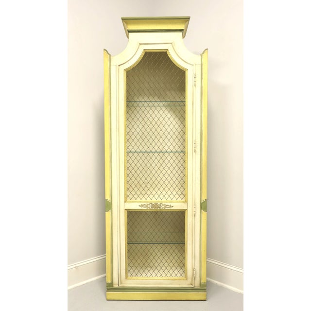 A Neoclassical style display cabinet by Thomasville. Solid hardwood painted antique white, yellow & green, pediment crown...