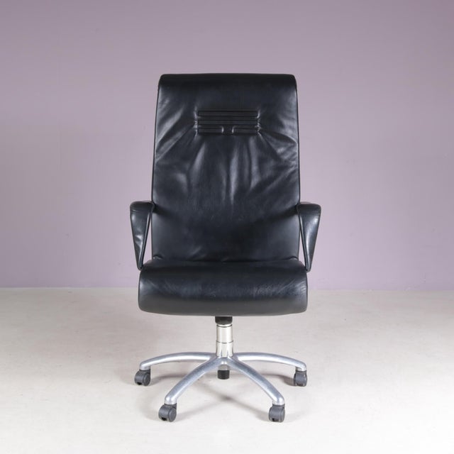 2000s luxury black leather executive desk chair by Poltrona Frau, Italy. This elegant and generously proportioned chair...