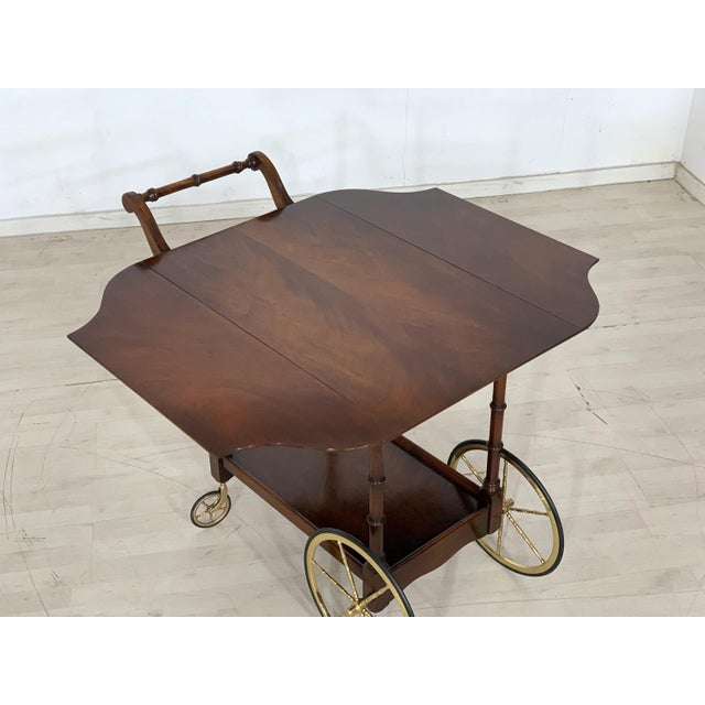 Beautiful, classic serving trolley in an elegant colonial/antique style. This piece of furniture impresses with its high-...