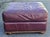 A large , comfortable Robinson and Robinson Furniture Top Grain Leather Ottoman in burgundy color. Soft top grain leather....